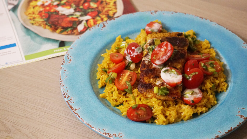 HelloFresh Baja barramundi with salsa fresca, yellow rice, and lime crema