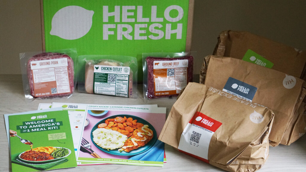 HelloFresh ingredients sorted into labeled paper bags for each recipe