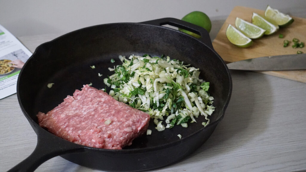 Preparing HelloFresh Spicy Coconut Curry Pork Noodle Soup during cooking