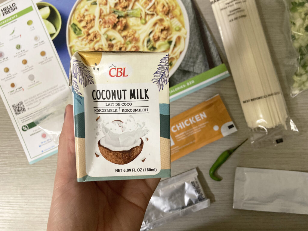 HelloFresh Spicy Coconut Curry Pork Noodle Soup ingredients including pork, noodles, coconut milk, and curry spices