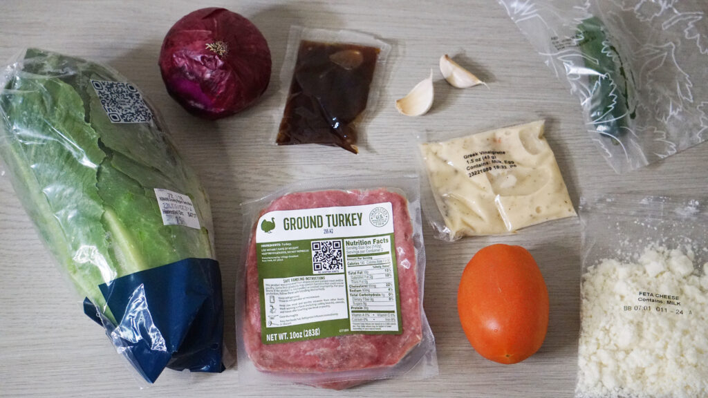 HelloFresh Turkey & Greek Salad Lettuce Wraps ingredients including ground turkey, lettuce, tomato, feta, and herbs