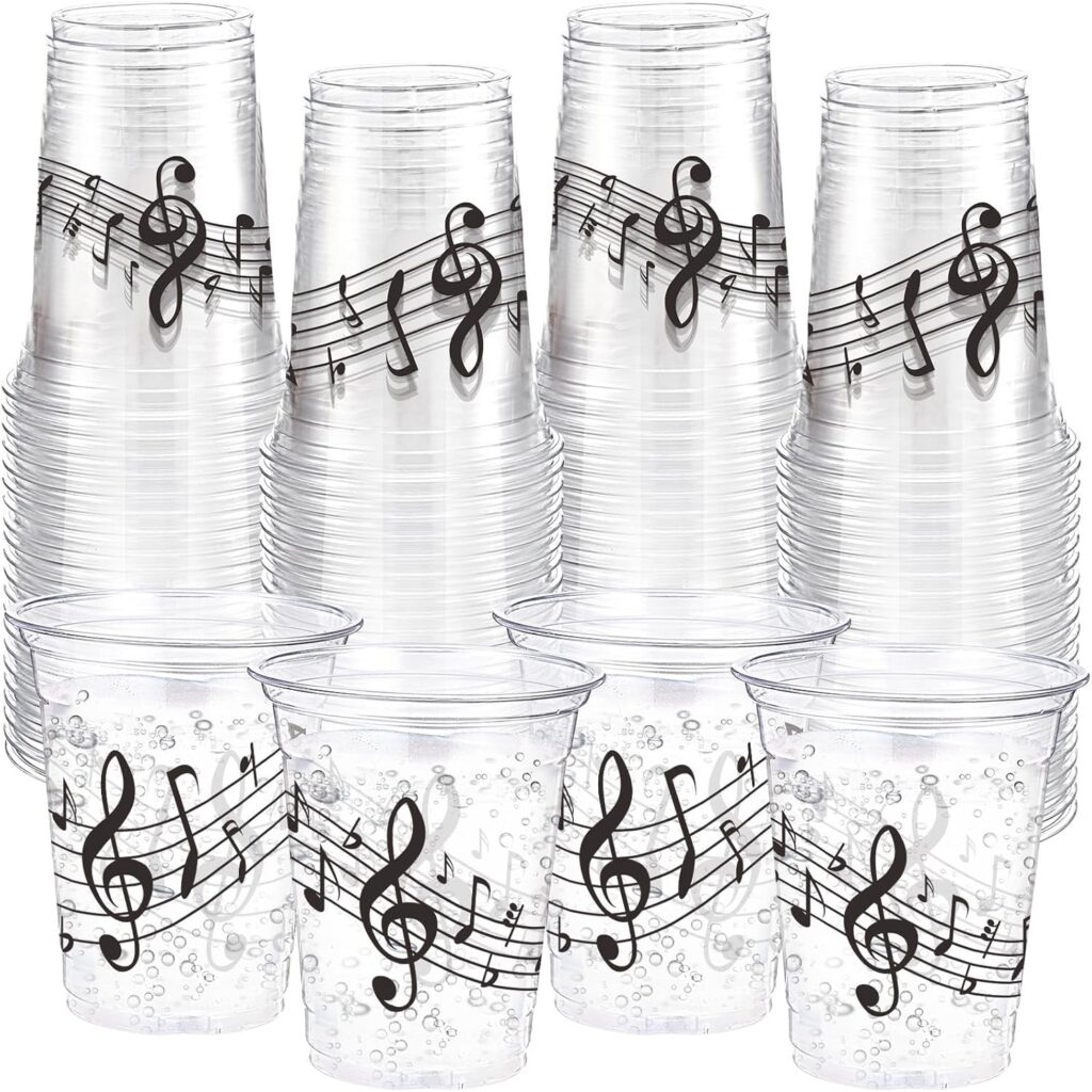 Party drink cups with musical note designs displayed for a Michael movie night inspired by Michael Jackson’s music and reported drink preferences.