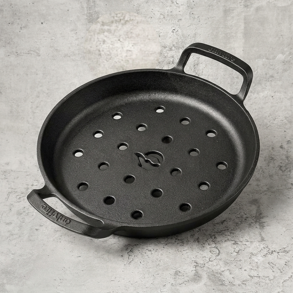 Cast iron perforated grill skillet for making crispy stovetop pizza with direct heat and an evenly browned pizza crust.