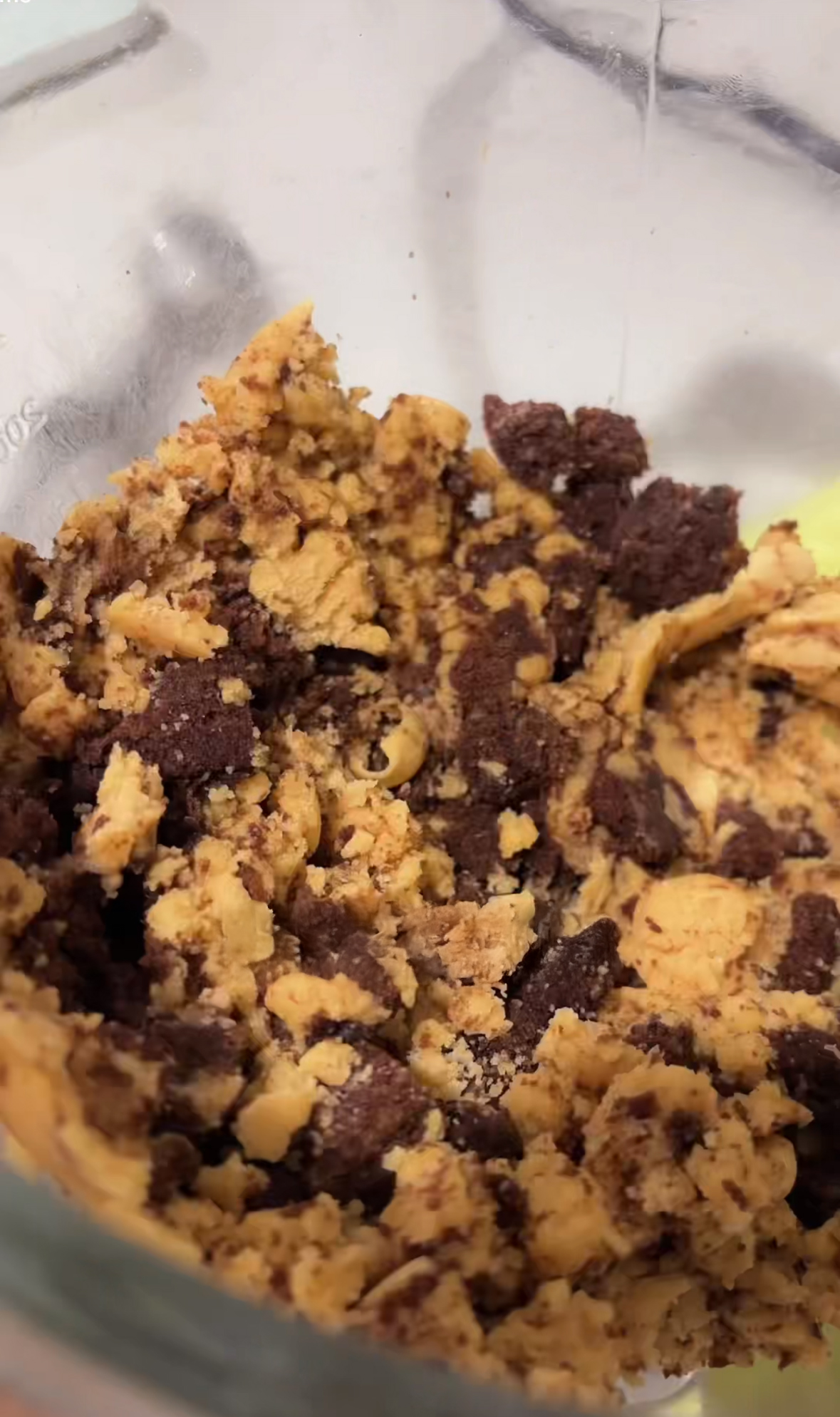 Chocolate chip cookie dough mixed with frozen brownie bits